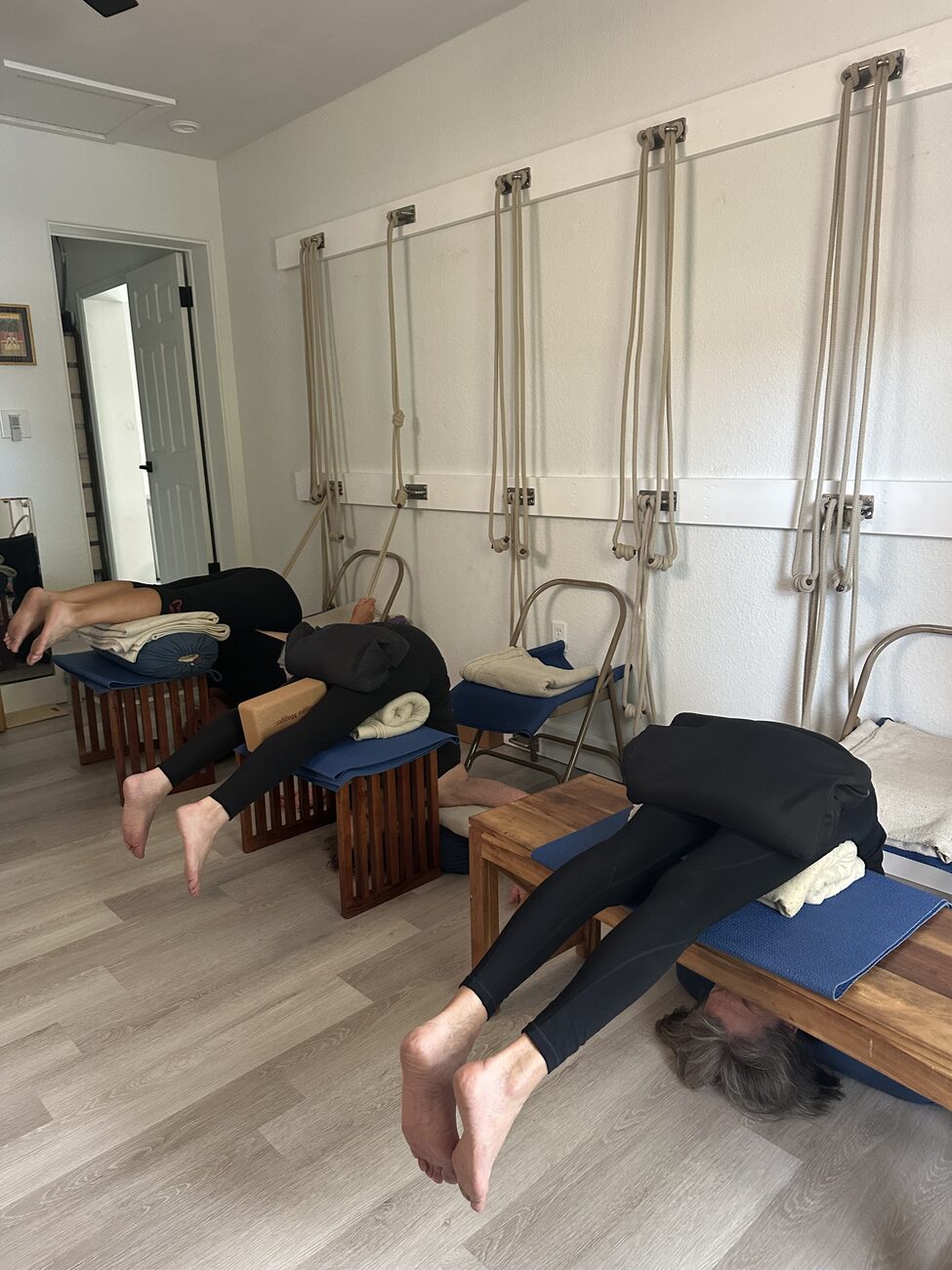 Semi-private Iyengar yoga class with props at the instructor's residence