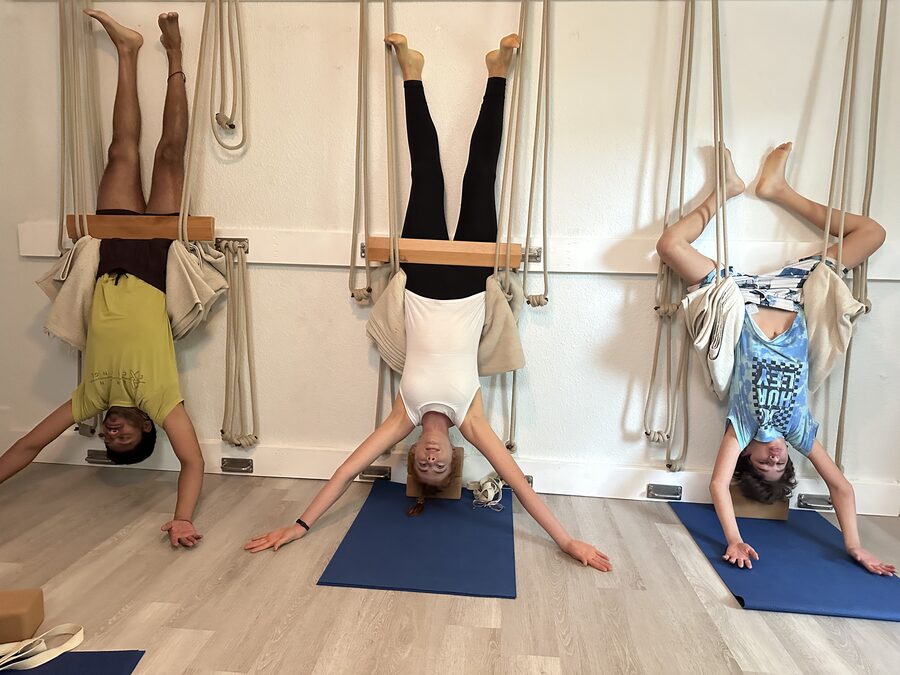 Rope wall Sirsasana in a semi-private class